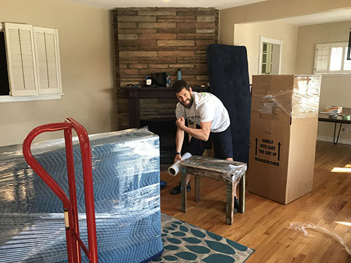 Northridge_Movers-packing_furniture